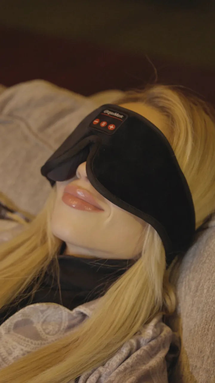 Close profile of a person wearing the mask, lying down in low light